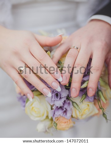 Hands and rings it is beautiful wedding bouquet