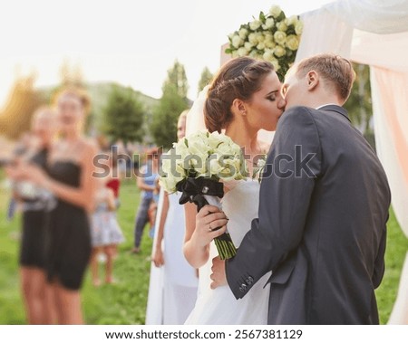 Similar – Image, Stock Photo Newlywed couple kissing during romantic travel