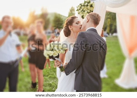 Similar – Image, Stock Photo Newlywed couple kissing during romantic travel