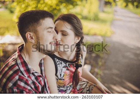 a young couple in love walking in the woods