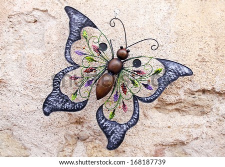 Decorative metal butterfly on the wall
