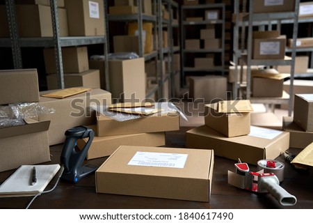 Distribution warehouse background, commercial shipping order boxes for dispatching on stockroom table, post courier delivery package, dropshipping commerce retail store shipment storage concept.