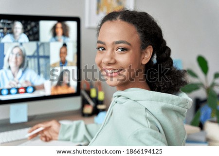 Teenage mixed race girl high school student distance e learning group online class at home looking at camera. Video conference call remote class, course, virtual digital education, headshot portrait.