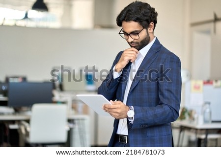 Similar – Foto Bild Fokussierter Mann mit Tablet im Büro