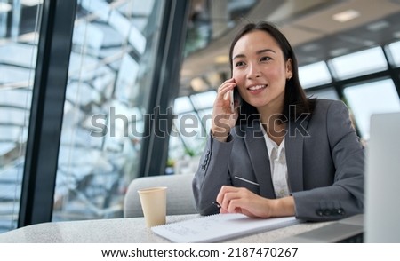 Similar – Image, Stock Photo Cheerful female manager speaking on smartphone on street