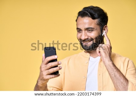 Similar – Image, Stock Photo Man with earbuds using tablet and laptop at table