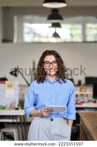 Image, Stock Photo young woman 30 years in snow with red coat and leopard dress blond hair curls joy hopeful street, black boots