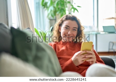 Similar – Image, Stock Photo Relaxed adult female looking at camera in sunlight