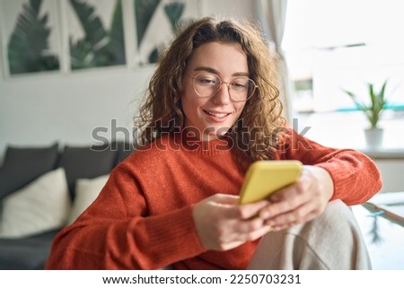 Similar – Image, Stock Photo Young woman sitting on chair near window in room