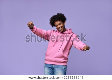 Similar – Image, Stock Photo Cheerful black male standing near striped wall