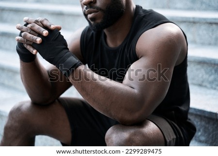 Similar – Image, Stock Photo Black serious sportive man using smartphone during workout