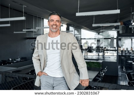 Similar – Foto Bild Geschäftsmann mittleren Alters mit Bart und Brille beim Kaffee im Büro