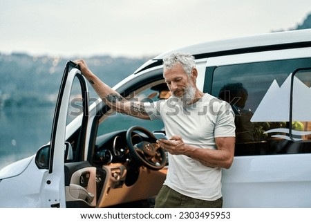 Image, Stock Photo Senior wanderer standing on hill in mountains