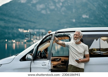 Similar – Image, Stock Photo Senior wanderer standing on hill in mountains