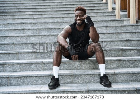 Similar – Image, Stock Photo Man in sportswear resting at stadium seat and use smartphone