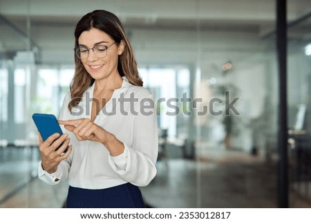 Similar – Image, Stock Photo Senior woman using mobile phone at home