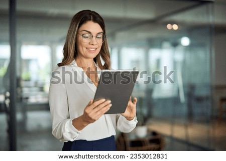 Similar – Image, Stock Photo Senior woman using tablet