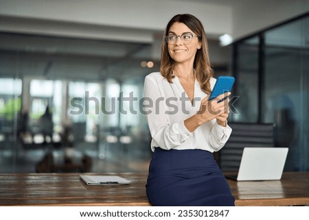 Similar – Image, Stock Photo Woman with smartphone leaning on stone house