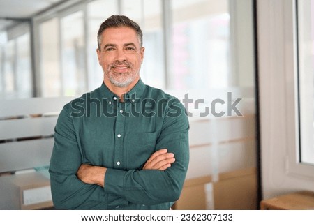 Similar – Image, Stock Photo Photo of good looking African American prosperous busineswoman waits for partner in office, drinks coffee discusses future plans with colleague looks away with cheerful expression wears formal clothes