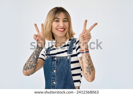 Similar – Image, Stock Photo Confident tattooed woman looking at camera