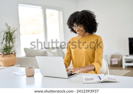 Similar – Image, Stock Photo Young african woman looking serious to camera during a exercise session in the city, urban style image, sport and activities in the city, copy space