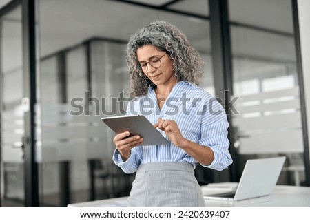 Similar – Image, Stock Photo Senior woman using tablet