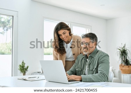 Similar – Image, Stock Photo Happy couple looking at each other on beach