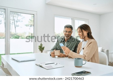 Similar – Image, Stock Photo Happy couple looking at each other on beach