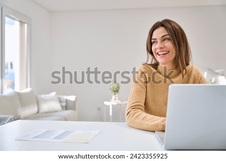 Similar – Image, Stock Photo Happy middle-aged woman smiling while looking out the window.