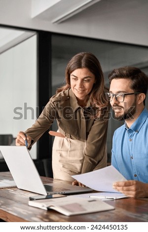 Similar – Image, Stock Photo Business colleagues discussing financial data working together in office. People entrepreneurs working with charts and tables on computer. Two people working together