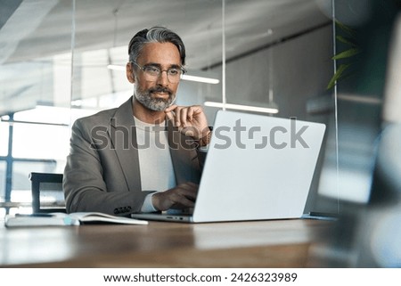 Similar – Image, Stock Photo Man working on laptop with his cat