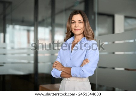 Similar – Image, Stock Photo Portrait of a woman looking at herself in the mirror.