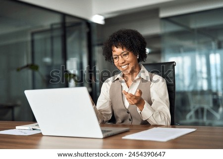 Similar – Image, Stock Photo Businesswoman having video chat on mobile phone with her colleague. Businesswoman working with data on charts, graphs and diagrams on computer screen