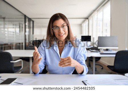 Similar – Image, Stock Photo Businesswoman having video chat on mobile phone with her colleague. Businesswoman working with data on charts, graphs and diagrams on computer screen