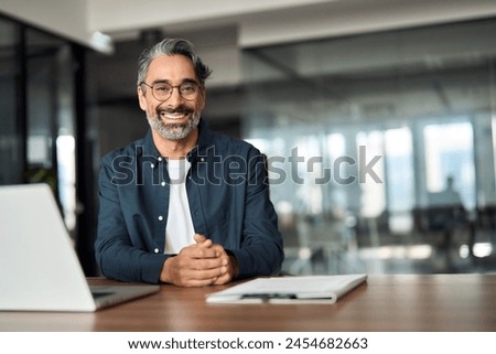 Similar – Image, Stock Photo Senior businessman in blue jacket using smartphone