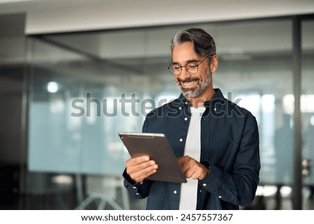 Similar – Image, Stock Photo An older man with a beard looks to the side tensely.