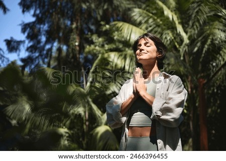 Similar – Image, Stock Photo Young girl doing yoga fitness exercise outdoor in beautiful mountains landscape. Morning sunrise, Namaste Lotus pose. Meditation and Relax. Healthy Lifestyle.