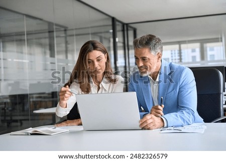 Similar – Image, Stock Photo Man entrepreneur having business  conversation on mobile phone. Businessman holding documents and smartphone working with data on charts and graphs in office