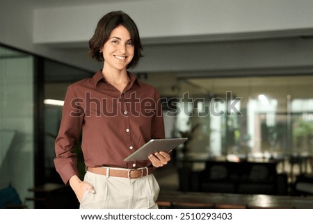 Similar – Image, Stock Photo Businesswoman working with financial data on charts and tables on smartphone and computer. Woman entrepreneur looking at sale stats