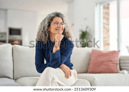 Similar – Image, Stock Photo Woman sit and relax on yoga mat and listen to music via smartphone at stone beach by the sea . Woman outdoor workout. Fit girl wear smart band. Healthy, chill out lifestyle. Relax on summer vacations.