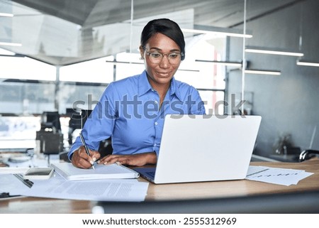 Similar – Image, Stock Photo African American lady using laptop in library to music