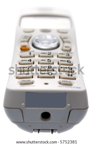 White Cordless phone isolated on white background. View from bottom of the handset. Focus on keypad.