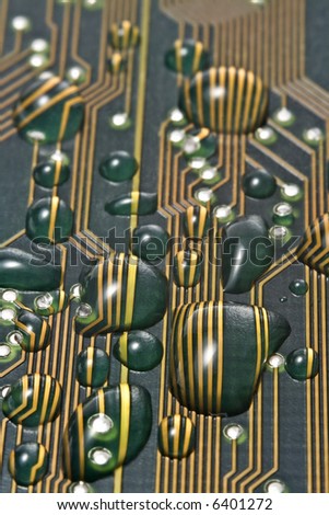 A circuit board splattered with water dropplets causing short-circuits. Shallow DOF. Extreme Macro Closeup.