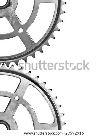 Two cogs interlocking right in the middle of the frame. Isolated on white. White space at the right.
