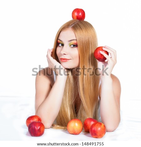 portrait of beautiful red-haired woman with peaches over white background
