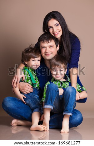 Portrait of happy fun beautiful family with two children