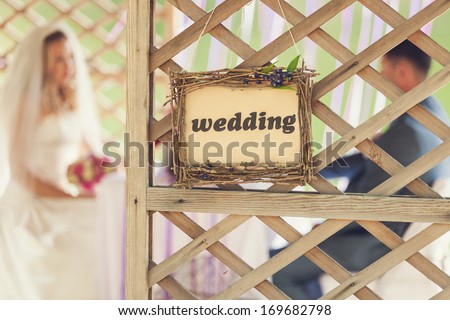 Wedding decor. Wooden plaque with the inscription Wedding