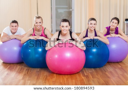 Group of friends working out at the fitness center