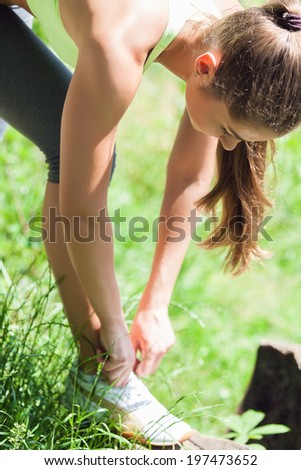 Young woman trying running shoes getting ready for jogging