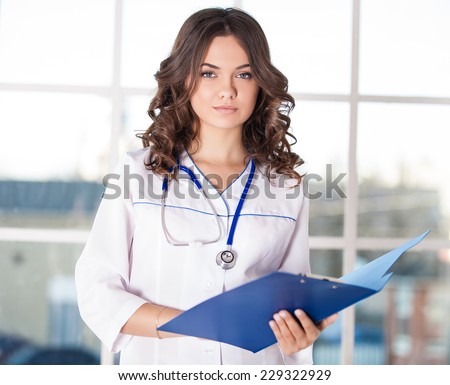Portrait of a friendly doctor looking happy